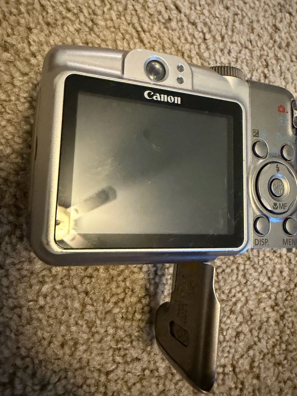 Canon PowerShot A720, battery door doesn’t stay shut